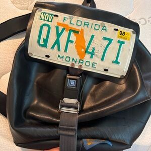 Vintage 1990’s Recycle Revolution Black Vinyl Backpack with License Plate Design